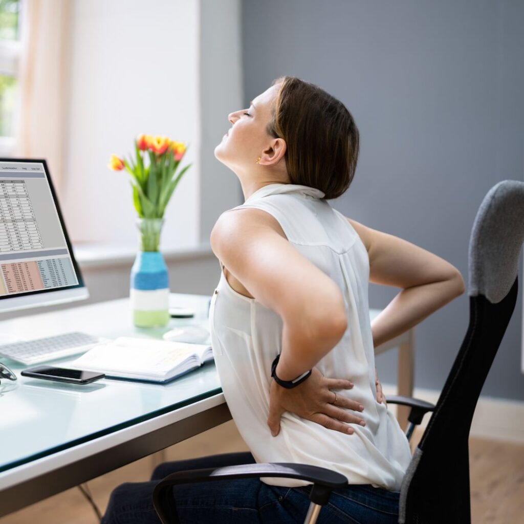 lower back pain, trying to stretch at desk